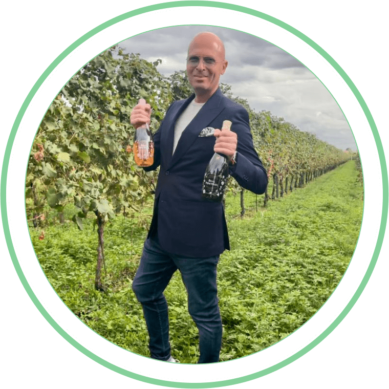 Prosecco Partners: Michael Goldstein, CEO and Founder of Prosecco Ventures, stands confidently in front of a Prosecco vineyard.